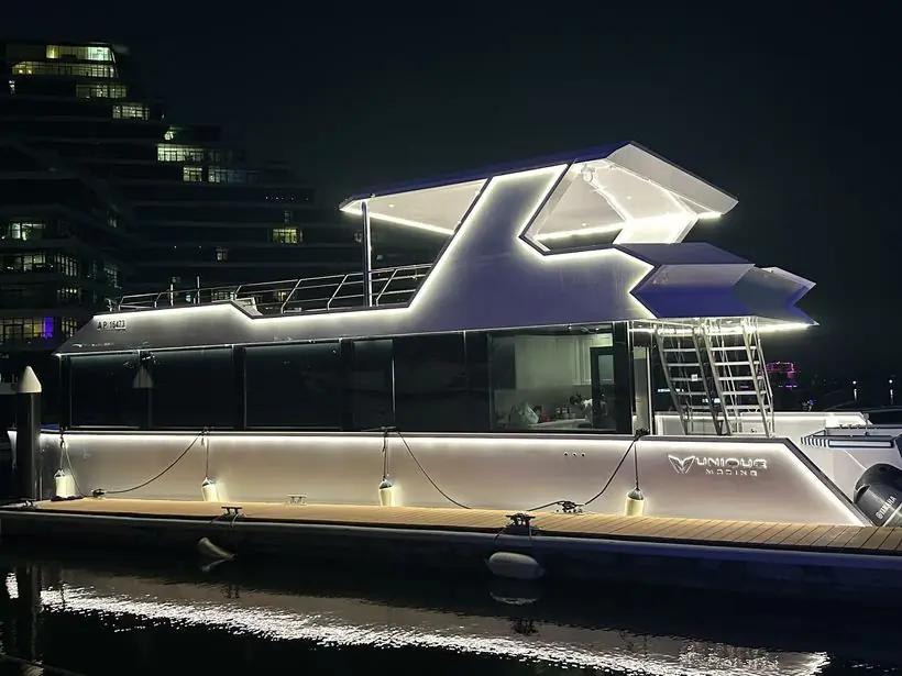 Yacht lit up at night